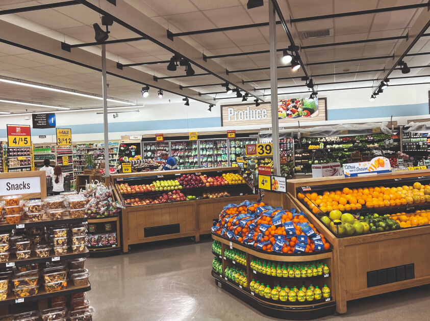 a photo of the vegetable section in a supermarket