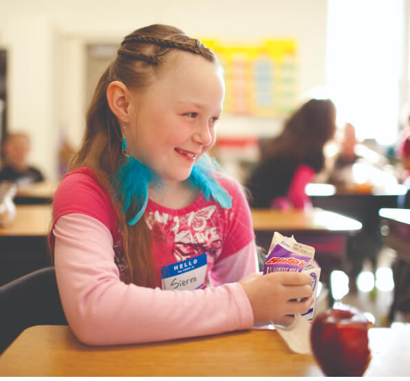 a photo of a young girl smiling